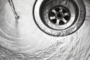 What is the proper way to clean a sink