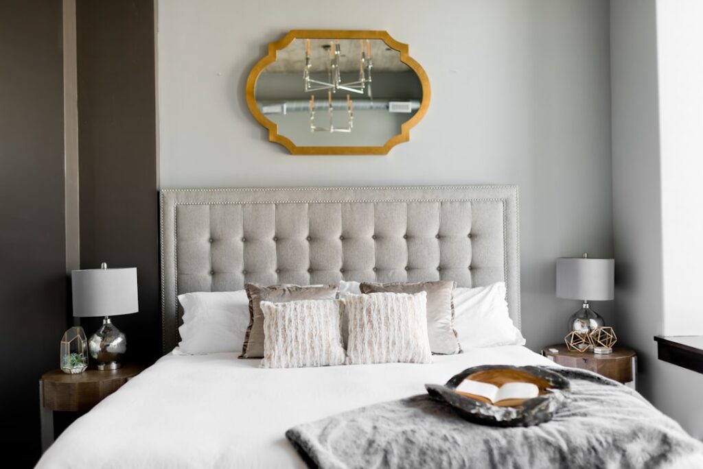 Airbnb cleaning - tufted white bed near window