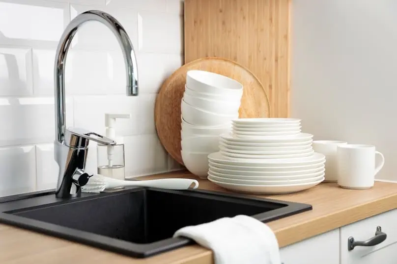 Modern kitchen sink illustrating the importance of knowing how to clean a kitchen sink drain.