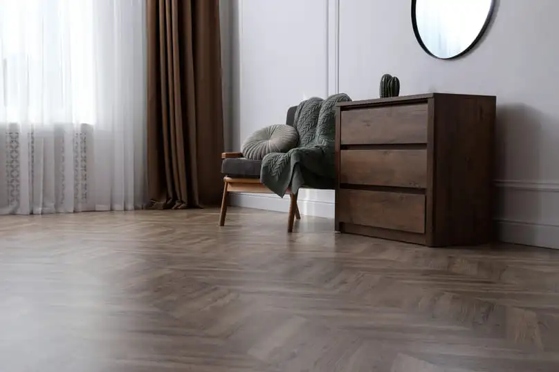 A modern room with vinyl flooring, showcasing the need to know how to clean vinyl floors.