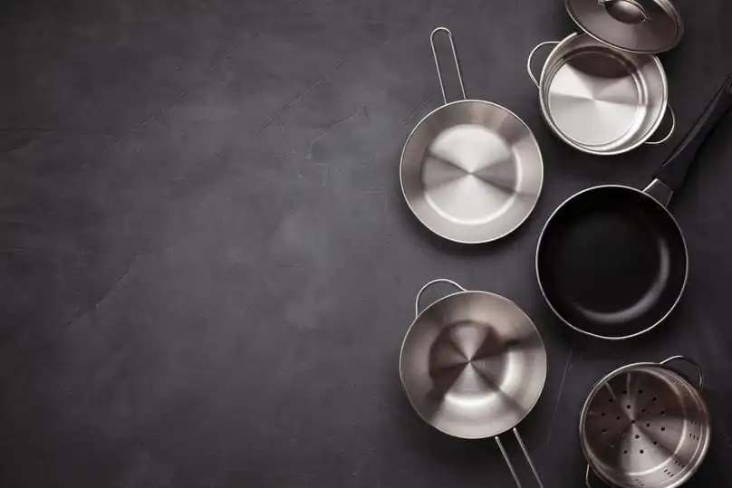 A clean kitchen with a stainless steel stove, for how to clean stainless steel appliances.