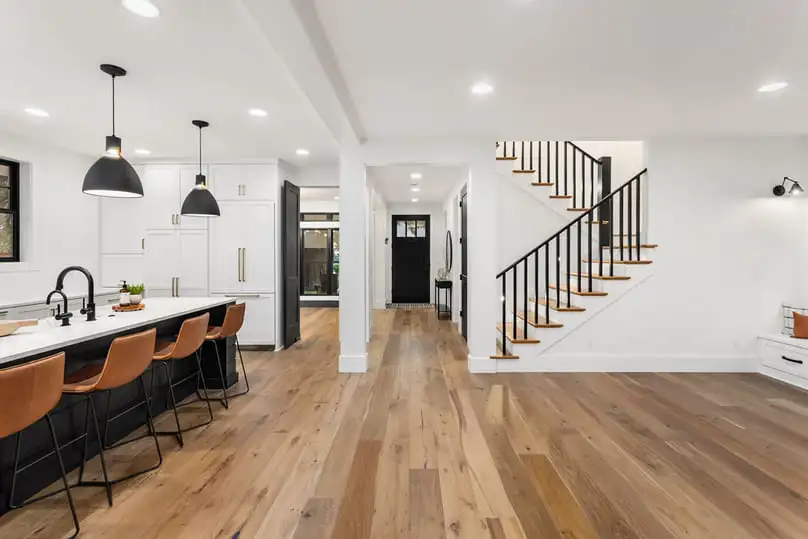 Modern kitchen with natural hardwood flooring, ideal for demonstrating how to clean wood floors.