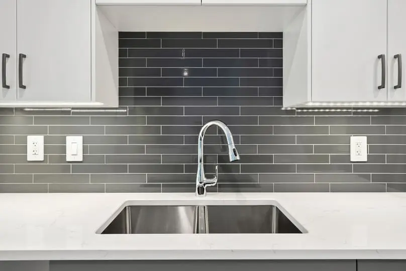 Stainless steel kitchen sink showing how to remove scratches from stainless steel sink.